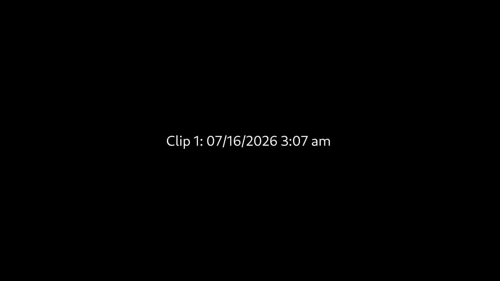 A black screen with white text in the center reading 