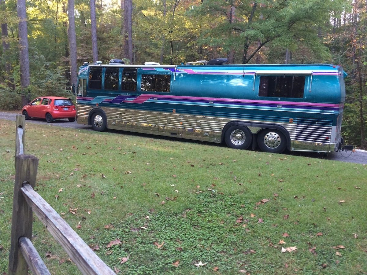 Large purple touring bus.