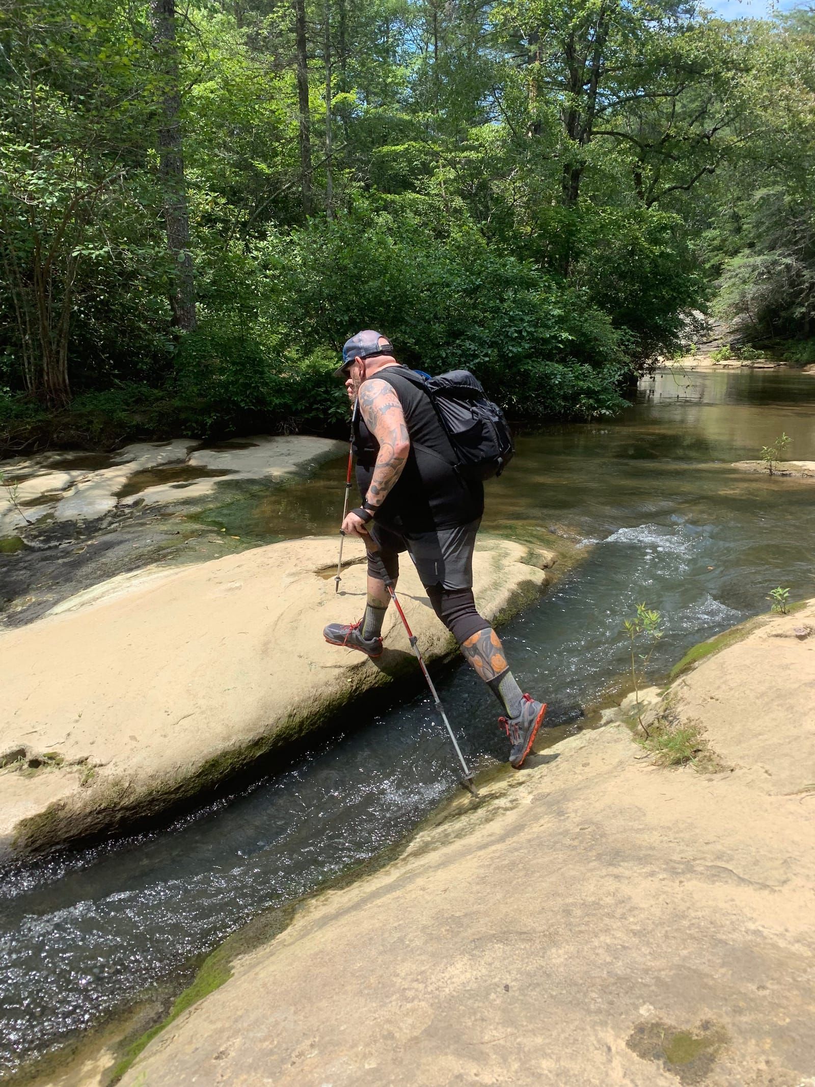 Mike crossing over the creek.