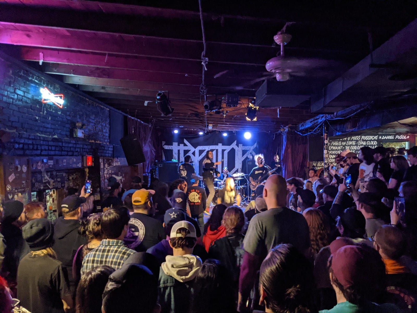 Lily the black cat, sleeps on her back on the back porch.