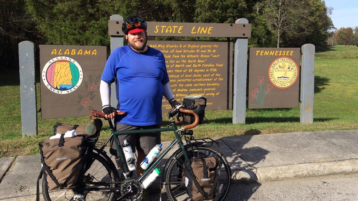 Mike with the Alabama/Tennessee stateline sign in the background.