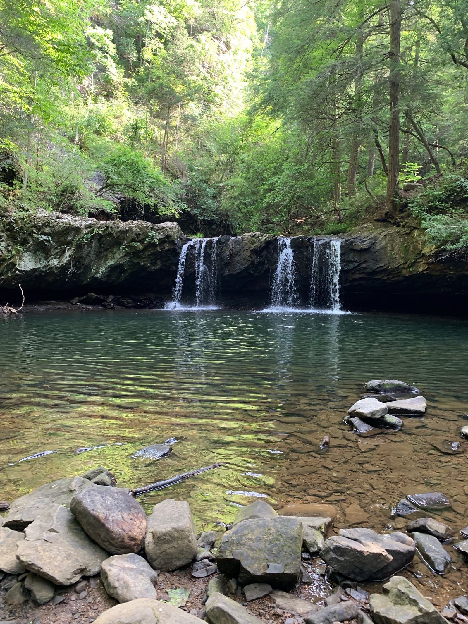 Sycamore Falls empties into a pool of water in the foreground.