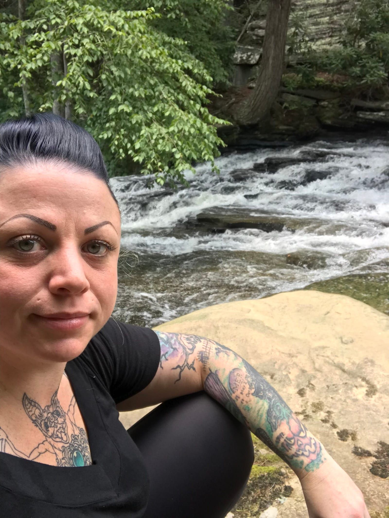 Selfie of Meredith relaxing at the top of Snow Falls.
