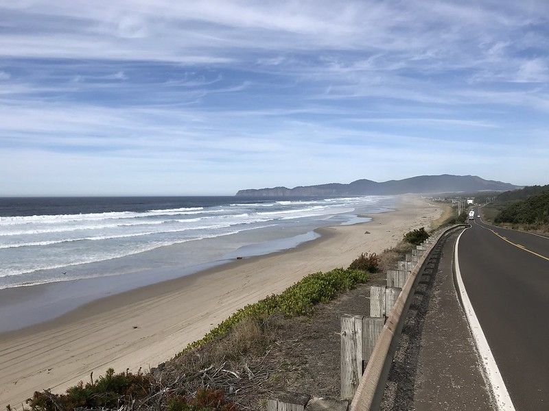 A view of the picturesque beach from the side of the road.