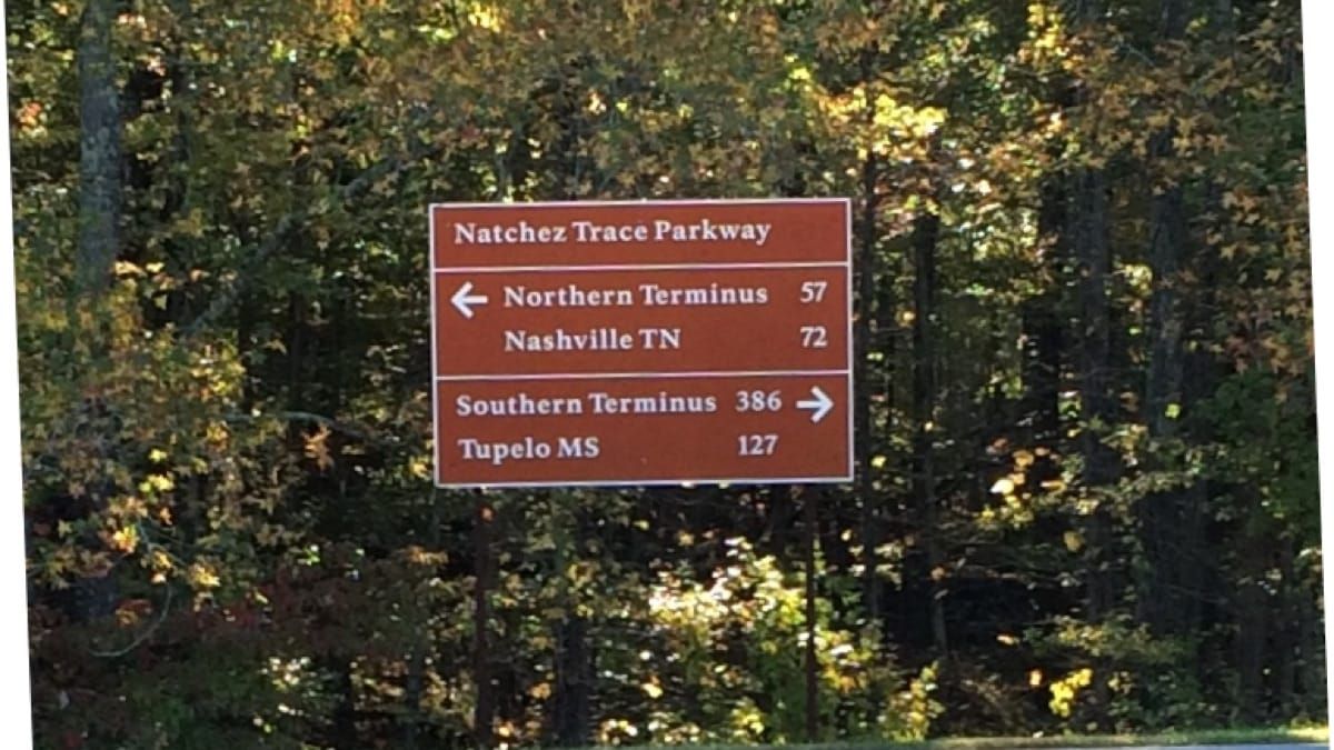 Road sign. Left, Nashville 72 miles. Right, southern terminus 386 miles.