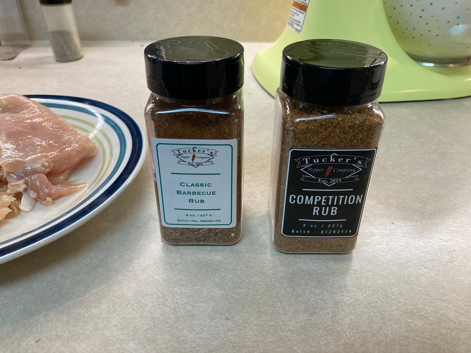 Bottles of Tuckers Classic Barbecue Rub and Tuckers Competition Rub.
