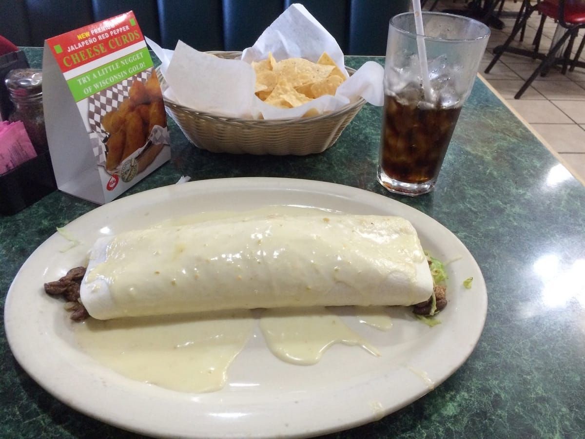 Giant burrito with queso.