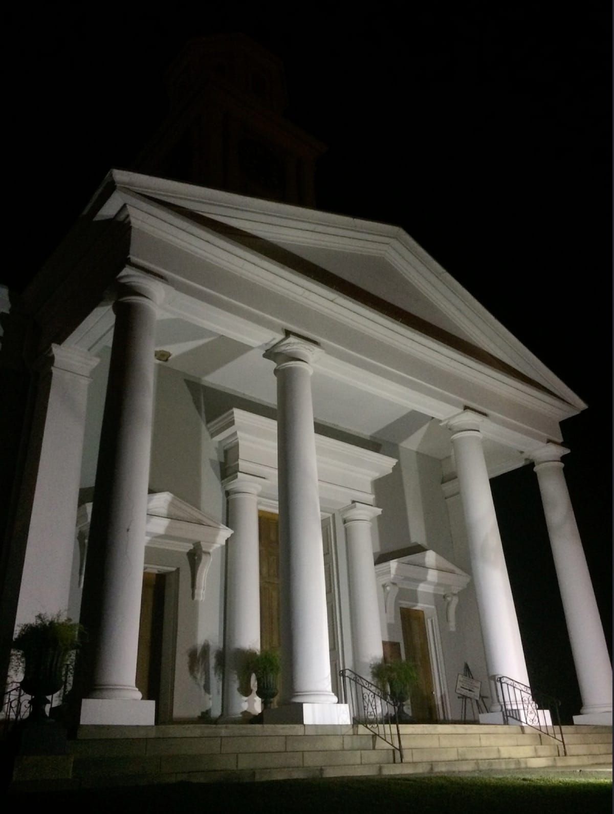 Nighttime photo of a governemnt building.