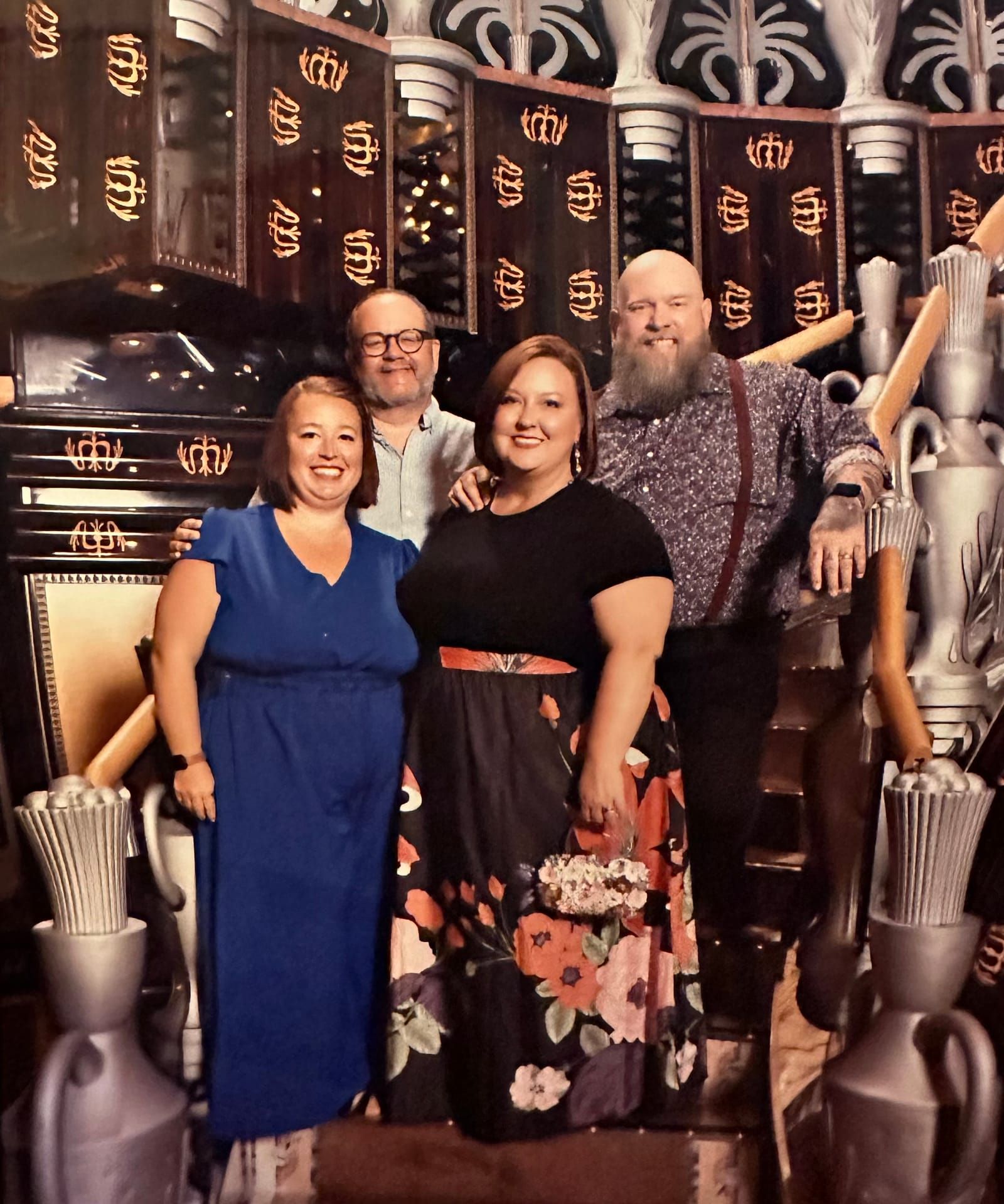 Photo of Tessica, Rachelle, Kevin and Mike wearing their fancy clothes, posing on stairs.