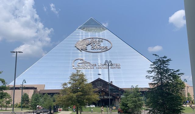 The giant bass pro shop pyrimid. The building is glass and has the bass pro shop logo on the front.