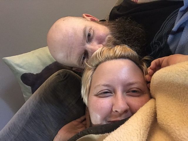 Mike and Rachelle self with smirks on their faces