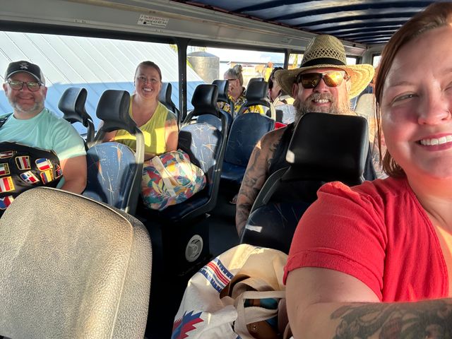 Selfie of Rachelle, Tessica, Kevin and Mike on the double decker shuttle bus.